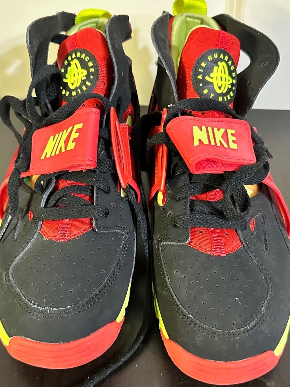 Mens, Size 8.5 Air Trainer Huarache shoes in the "Red Volt" colorway, featur